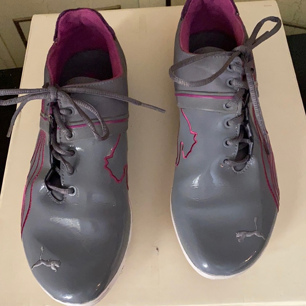 Puma grey patent leather sneakers.